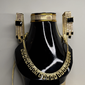 A black mannequin showcasing a zircon necklace and matching earrings set.